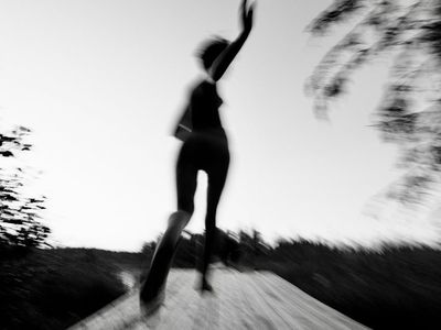 Blurred motion of a person running in place.