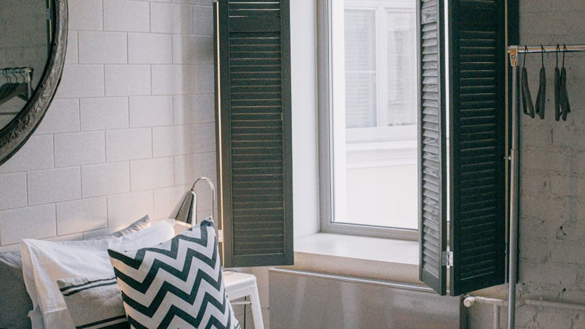 Person doing light cardio movement in a bright minimalist room.